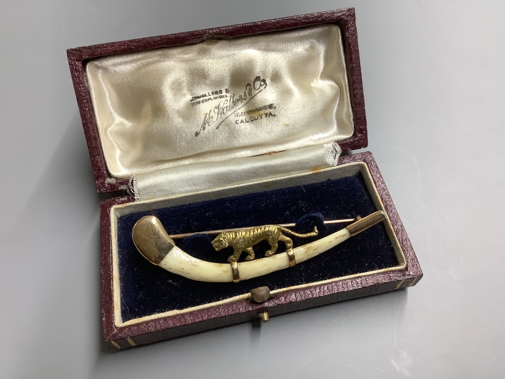 An Indian 14ct and bone mounted 'tiger' set curved brooch, by Hamilton & Co, in original box